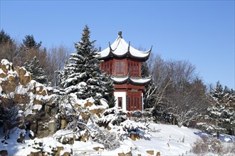 Chinese pavilion in snow at the botanical garden