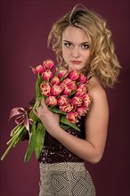 Young woman with a bouquet of tulips