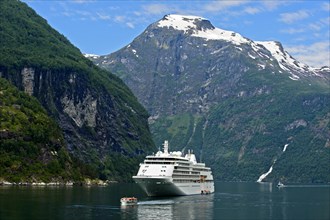 Cruise ship Silver Whisper and shuttle boat in Geiranger