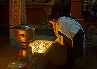 Bhutanese man at the ceremony of the 1000 butter lamps in a Buddhist monastery