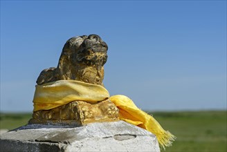 Sculpture of lion with yellow prayer shawl