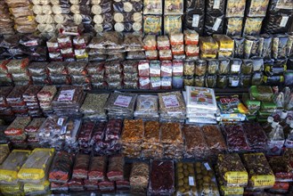 Various food products and candies in a stall