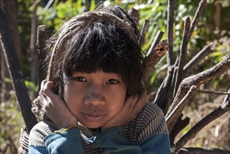 Girl from Palaung tribe carrying firewood