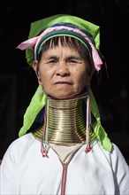 Woman from the tribe of the Padaung in typical dress and headgear