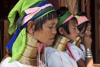 Women from the Padaung tribe in typical dress and headgear