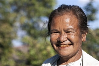 Old local woman laughing