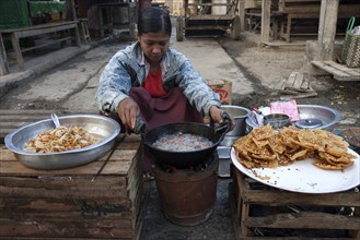 Local woman frying food
