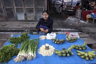 Local woman selling vegetables at the market in Nyaungshwe