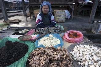 Local woman selling vegetables at the market in Nyaungshwe