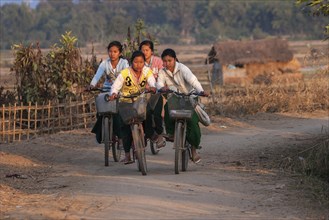 Local girls on bicycles returning from school