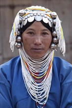 Local woman from the Akha tribe with typical headgear
