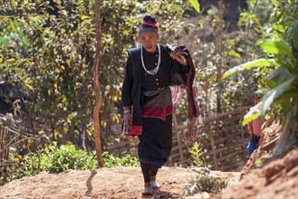 Native woman in typical clothing from the Ann tribe in a mountain village at Pin Tauk