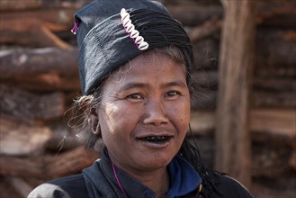 Native woman in typical clothing and headgear from the Ann tribe in a mountain village at Pin Tauk