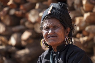 Native woman in typical clothing and headgear from the Ann tribe in a mountain village at Pin Tauk