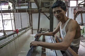 Local man working on a loom