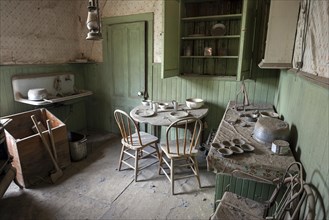 A kitchen in an old house located in a ghost town