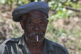 Local man with a cigarette and cap