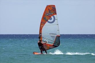Windsurfer surfing in the sea