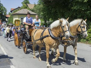 Horse-drawn carriage at Traditional parade on the Schliersee church day