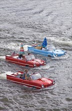 Amphibious vehicles in river