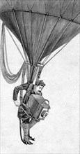 A Japanese war photographer hanging on a gas balloon