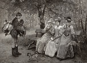 A hawker offering his range to three ladies