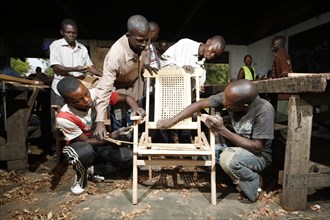 Apprentices working on chair