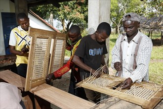 Apprentices working on chair
