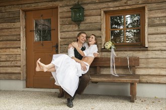 Wedding couple in front of an alpine mountain hut