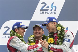 The drivers of the third-placed Audi R18 e-Tron Quattro from Audi Sport Team Joest