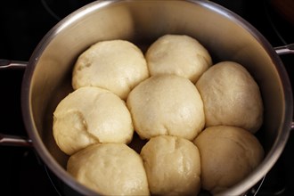 Steamed yeast dumplings in a pot