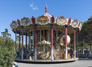 Historical carousel with stairs in the amusement park by the sea, Sanary-sur-Mer