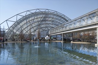 Trade fair with pond and footbridge