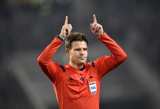 Referee Dr. Felix Brych gestures for throw