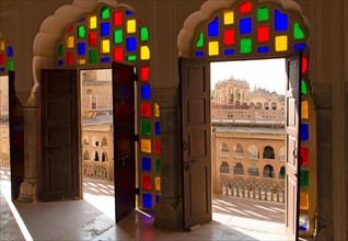 Colourful glass doors overlooking the courtyard of the Hawa Mahal