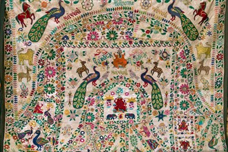 Embroidered blanket with Indian motifs and lettering Good Luck