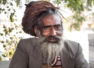 Smiling Rajasthani with matted hair and beard