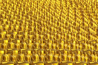 Small golden Dhammakaya Buddha statues at the Chedi