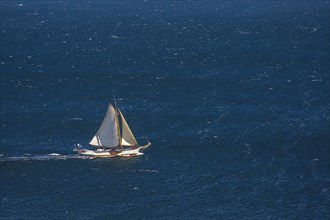 Sailing boat on windy sea