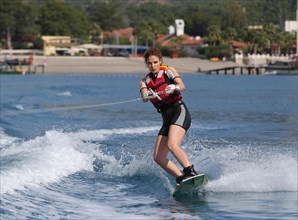 Young woman wakeboarding