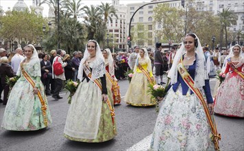 Women in traditional dress during procession at the festival of San Vicente Ferrer