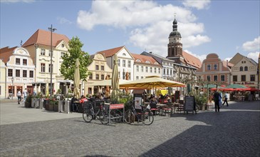 Altmarkt square with people sitting outside at cafes