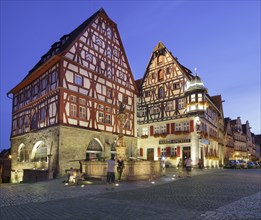 Typical medieval buildings with St George's Fountain