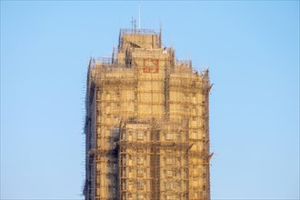 Skyscraper covered with bamboo scaffolding