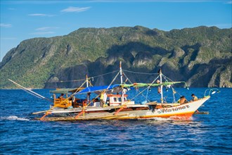 Filipino outrigger fishing boat off the coast of Coron Island