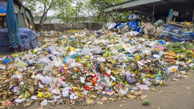 Pile of trash and rotten food at street market