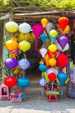 Silk lanterns for sale in front of a shop in Há»™i An ancient city