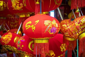 Red silk lanterns for sale during Vietnamese New Year festival or Tet