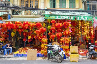 Shops selling red silk lanterns for sale during Vietnamese New Year festival or Tet