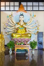 Many-armed Buddha statue at Linh An Pagoda or Chua Linh An